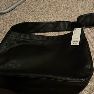 Leather touch round shoulder bag